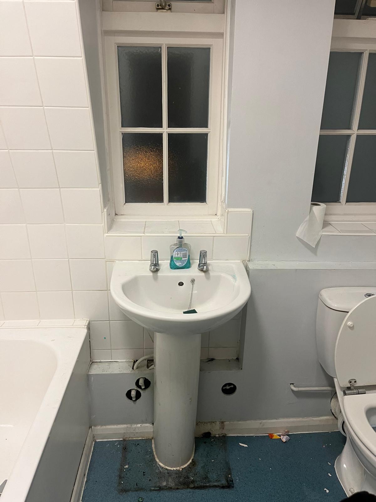 Original pedestal basin and close coupled WC before works