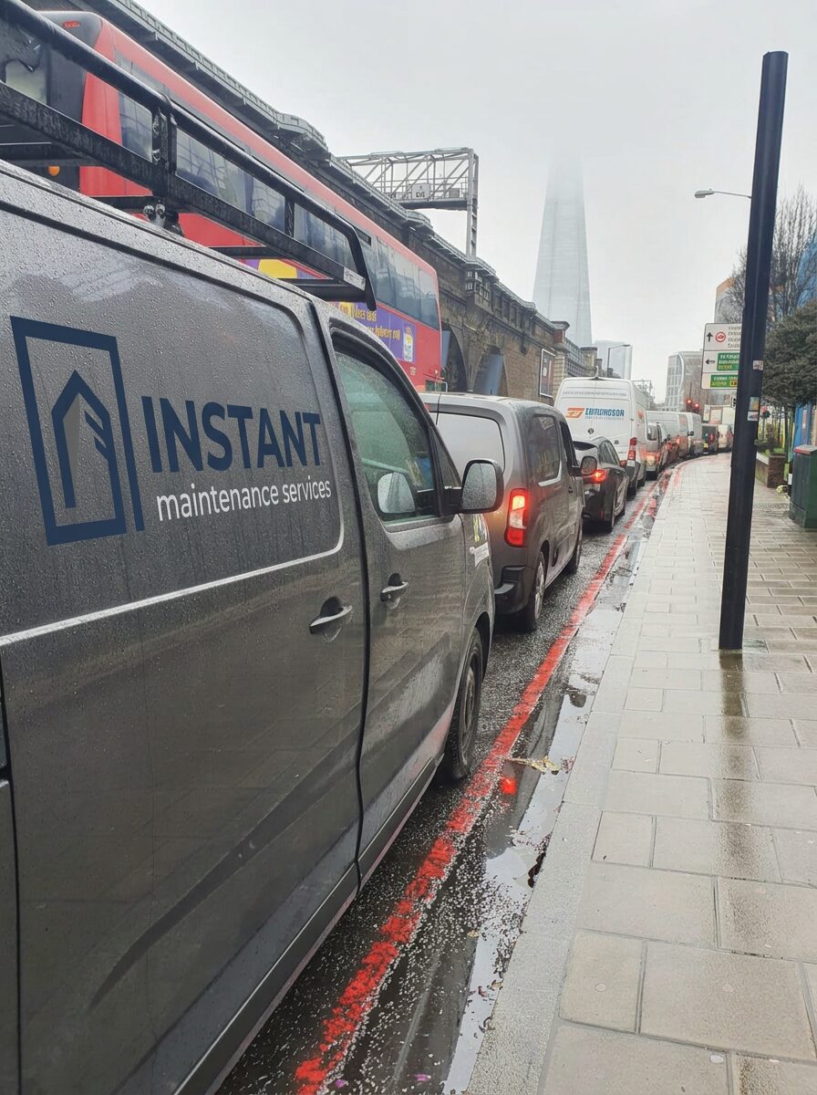 Instant Maintenance and Building Services van on a central London road near the Shard