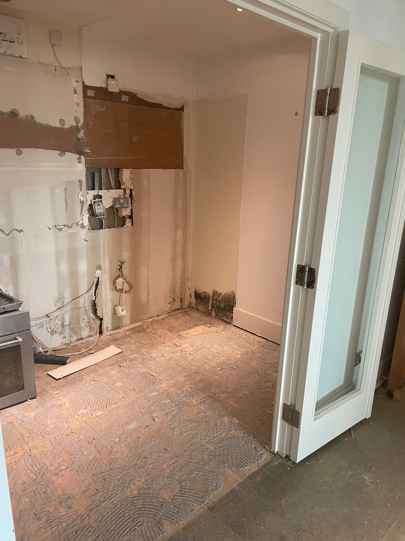Kitchen corner and floor exposed ready for preparation and making good