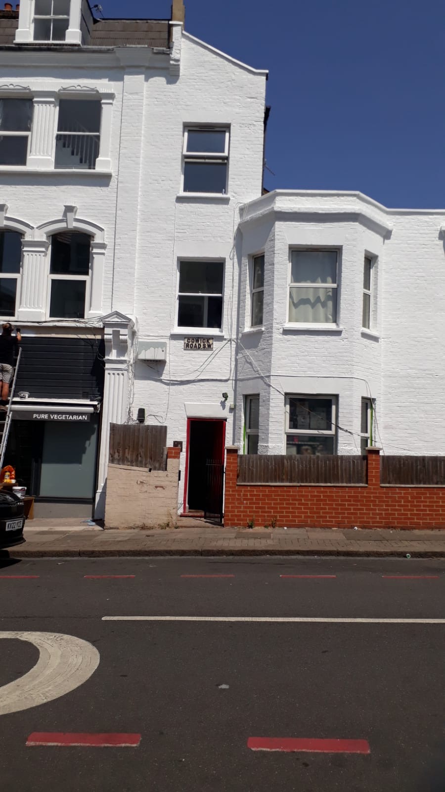 Cowick Road frontage with repaired bay and freshly painted brickwork
