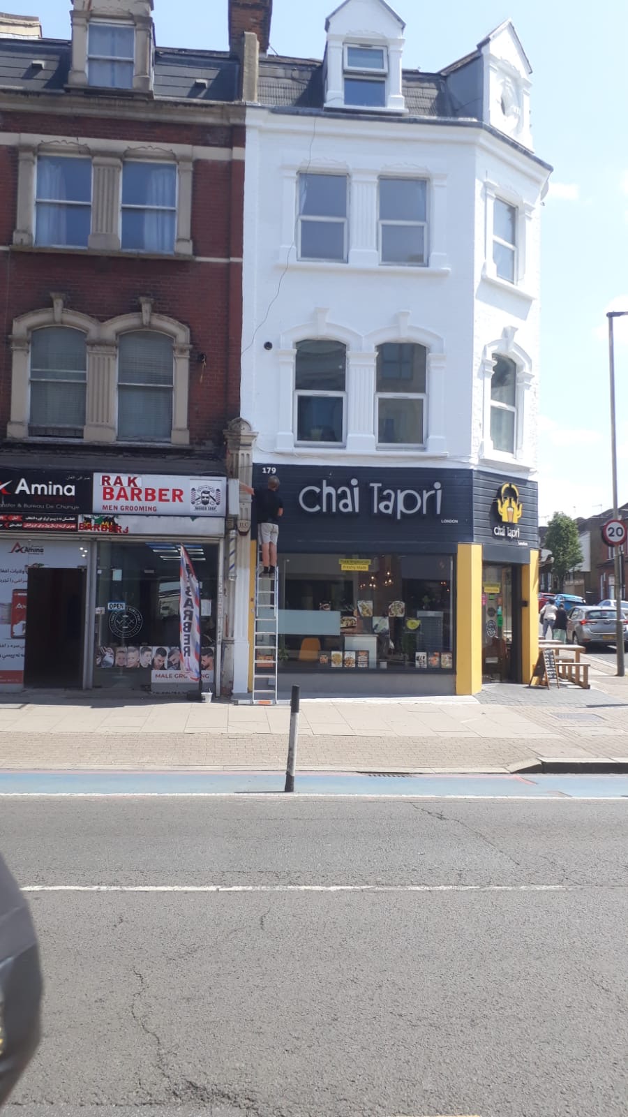 Final touching up to the Upper Tooting Road frontage after scaffold strike