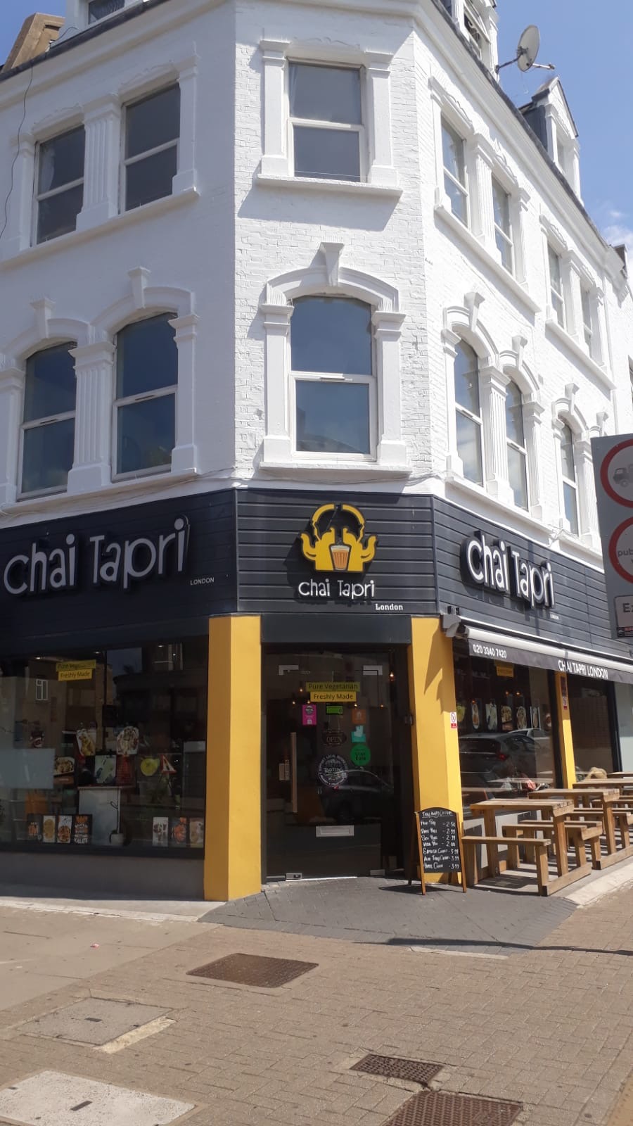 Corner shopfront and upper floors after the facade works were completed