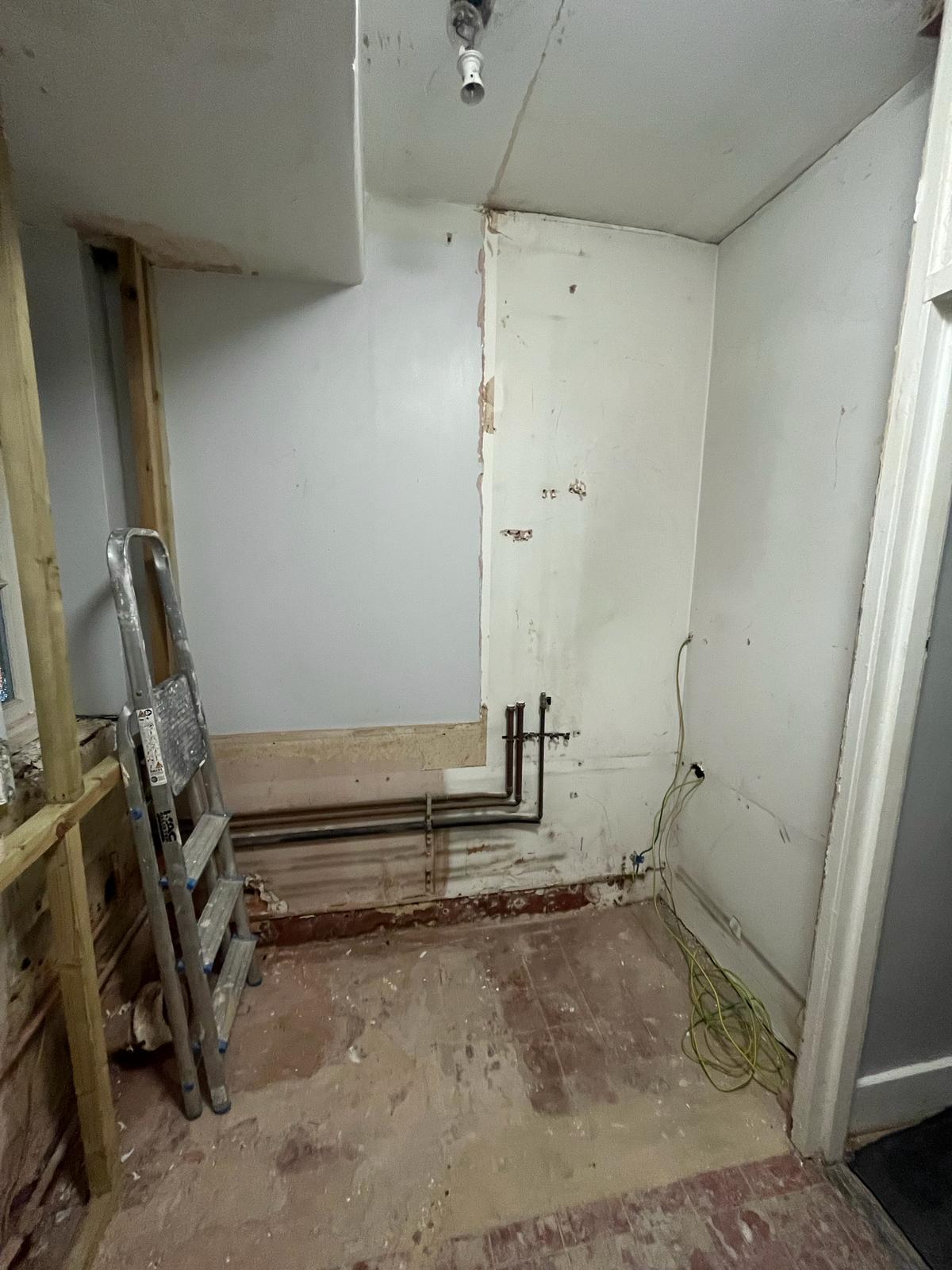 Room taken back to floor and walls ready for first fix