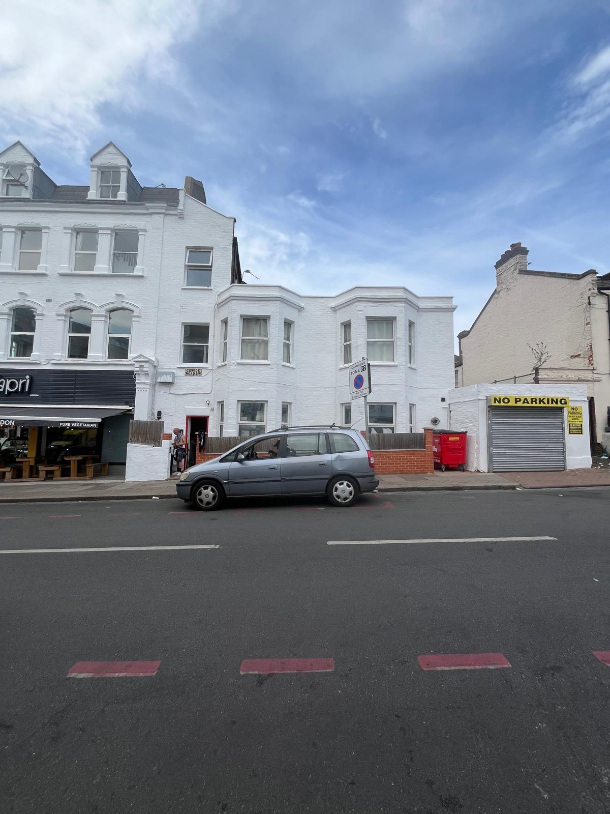 Completed Cowick Road elevation redecorated in white masonry paint