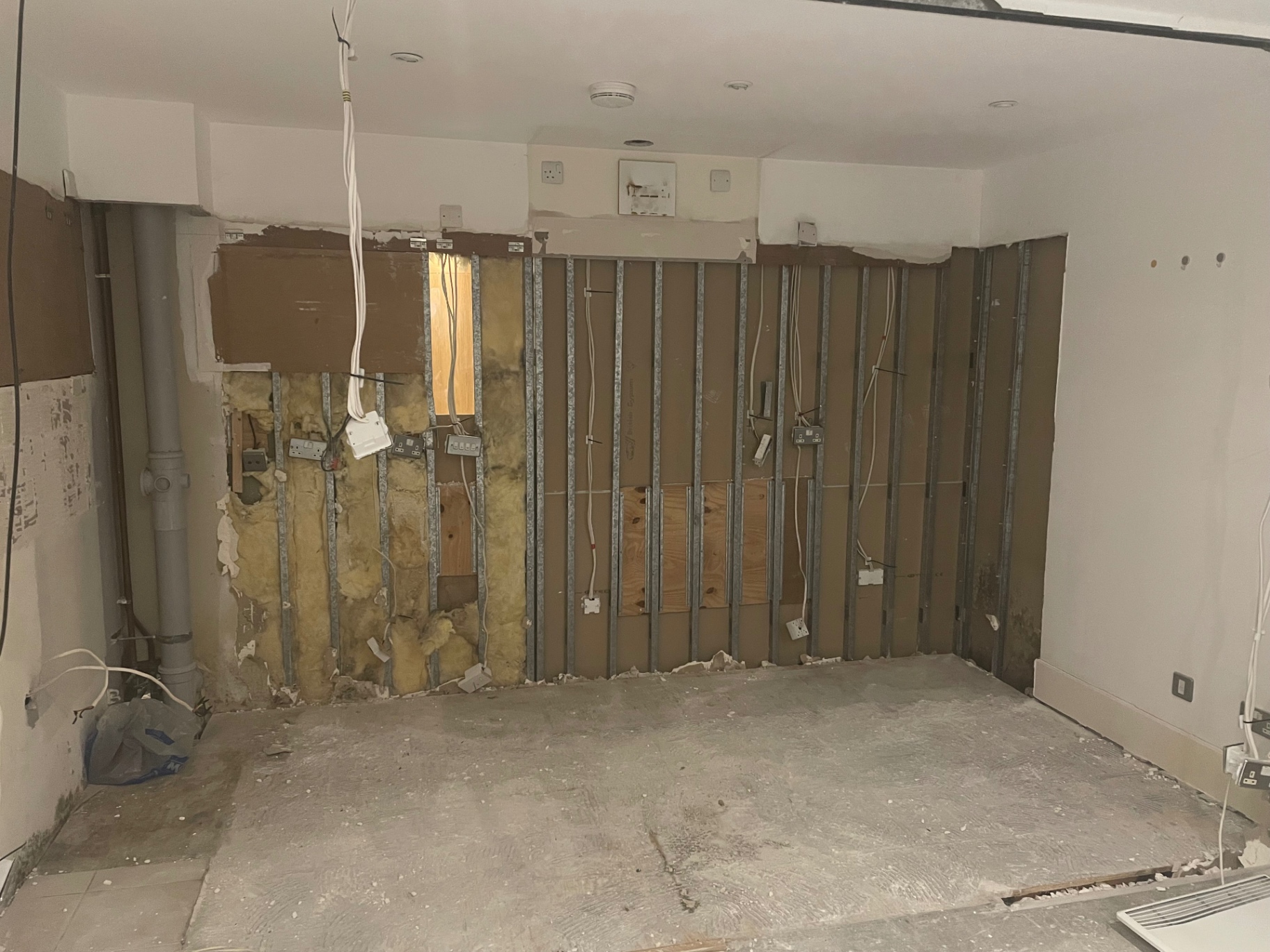 St George’s Wharf kitchen area stripped back to its wall framing before the refit